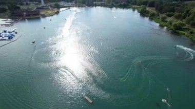 High Angle Footage of Willen Lake, Water Sports and Public Park of England. Beautiful Aerial Drone's Camera  Footage of Willen Lake and Park which is located at Milton Keynes, England.