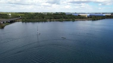 High Angle Footage of Willen Lake, Water Sports and Public Park of England. Beautiful Aerial Drone's Camera  Footage of Willen Lake and Park which is located at Milton Keynes, England.