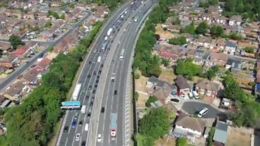 Aerial View of British Motorways With Traffic at Peak Time, High Angle Footage taken with drone's camera at Luton City of England UK, M1 J11 Motorways Junction Interchange.