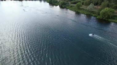High Angle Footage of Willen Lake, Water Sports and Public Park of England. Beautiful Aerial Drone's Camera  Footage of Willen Lake and Park which is located at Milton Keynes, England.