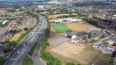 Aerial View of British Motorways With Traffic at Peak Time, High Angle Footage taken with drone's camera at Luton City of England UK, M1 J11 Motorways Junction Interchange.