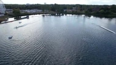 High Angle Footage of Willen Lake, Water Sports and Public Park of England. Beautiful Aerial Drone's Camera  Footage of Willen Lake and Park which is located at Milton Keynes, England.