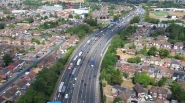 Aerial View of British Motorways With Traffic at Peak Time, High Angle Footage taken with drone's camera at Luton City of England UK, M1 J11 Motorways Junction Interchange.