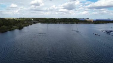 High Angle Footage of Willen Lake, Water Sports and Public Park of England. Beautiful Aerial Drone's Camera  Footage of Willen Lake and Park which is located at Milton Keynes, England.