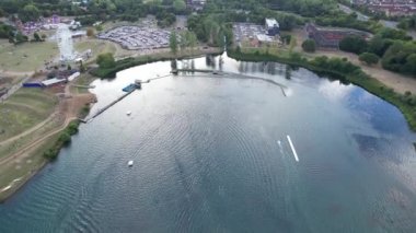 High Angle Footage of Willen Lake, Water Sports and Public Park of England. Beautiful Aerial Drone's Camera  Footage of Willen Lake and Park which is located at Milton Keynes, England.