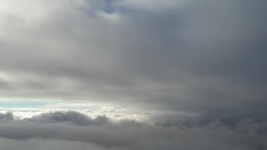 Most Beautiful Aerial View of Above the Clouds in the Morning. dramatically fast moving clouds