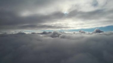 Most Beautiful Aerial View of Above the Clouds in the Morning. dramatically fast moving clouds