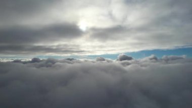 Most Beautiful Aerial View of Above the Clouds in the Morning. dramatically fast moving clouds