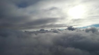 Most Beautiful Aerial View of Above the Clouds in the Morning. dramatically fast moving clouds