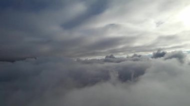 Most Beautiful Aerial View of Above the Clouds in the Morning. dramatically fast moving clouds