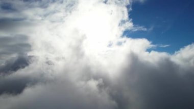 Most Beautiful Aerial View of Above the Clouds in the Morning. dramatically fast moving clouds