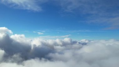 Most Beautiful Aerial View of Above the Clouds in the Morning. dramatically fast moving clouds