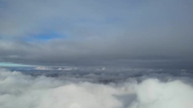 Most Beautiful Aerial View of Above the Clouds in the Morning. dramatically fast moving clouds