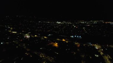 Night Aerial View of Illuminated British City. Drone's Footage of Luton Town of England at Night