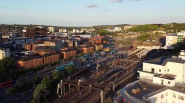 Aerial footage and high angle view of Train on Tracks at Central Luton Railway Station and City Centre of Luton Town of England UK