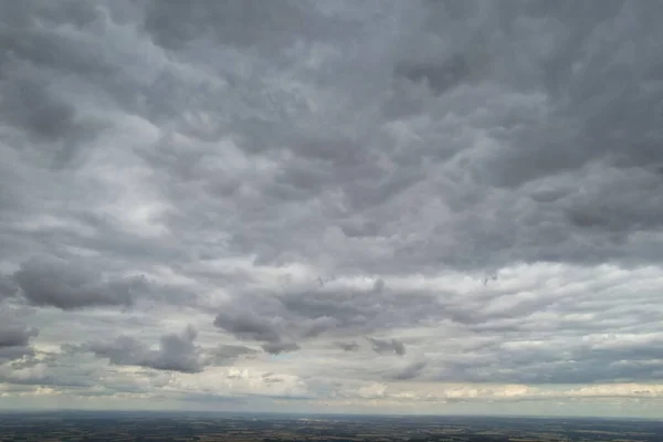 Aerial View of clouds and City houses. Beautiful High Angle Altitude View of Clouds and British Town of England UK, Air plane view at 360 degree.