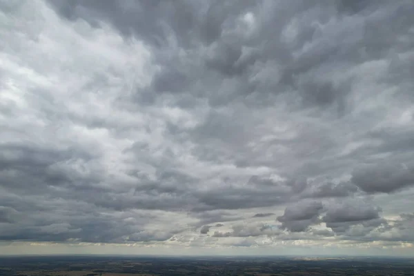 Aerial View of clouds and City houses. Beautiful High Angle Altitude View of Clouds and British Town of England UK, Air plane view at 360 degree.