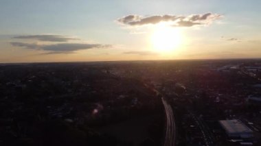Aerial footage and high angle view of Train on Tracks at Central Luton Railway Station and City Centre of Luton Town of England UK