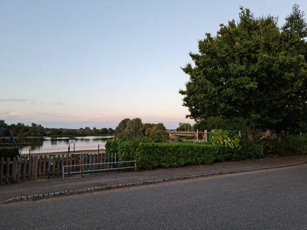 UK, ENGLAND, MILTON KEYNES  - 21ST SEPTEMBER, 2022: Aerial View of Caldecotte Lake and Buildings. Located at City of England, The Lake is Split into two sides of Road, It Has Pub, Restaurant and Hotels Around