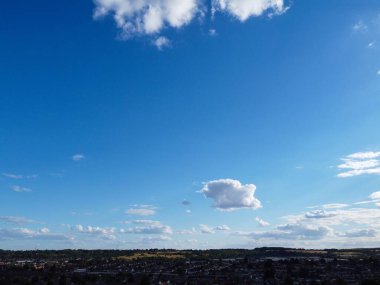 Aerial View of clouds and City houses. Beautiful High Angle Altitude View of Clouds and British Town of England UK, Air plane view at 360 degree.