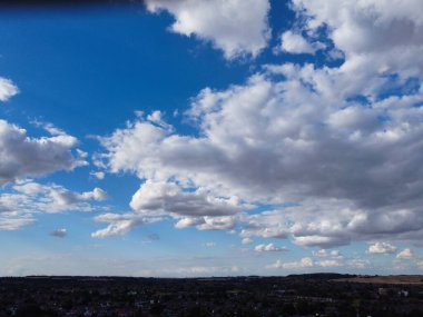 Aerial View of clouds and City houses. Beautiful High Angle Altitude View of Clouds and British Town of England UK, Air plane view at 360 degree.