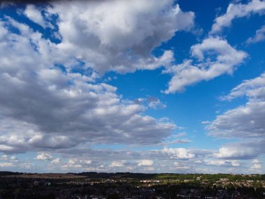 Aerial View of clouds and City houses. Beautiful High Angle Altitude View of Clouds and British Town of England UK, Air plane view at 360 degree.