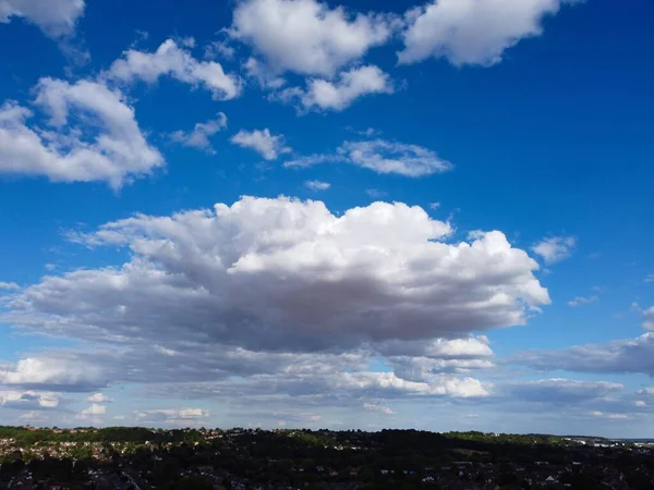 Aerial View of clouds and City houses. Beautiful High Angle Altitude View of Clouds and British Town of England UK, Air plane view at 360 degree.