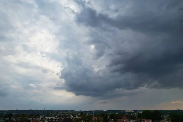 Aerial View of clouds and City houses. Beautiful High Angle Altitude View of Clouds and British Town of England UK, Air plane view at 360 degree.