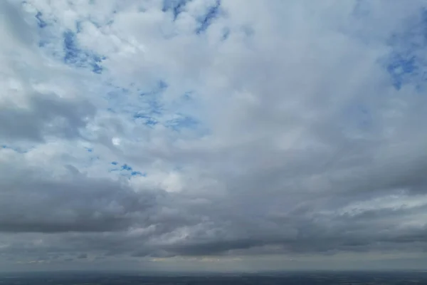 Aerial View of clouds and City houses. Beautiful High Angle Altitude View of Clouds and British Town of England UK, Air plane view at 360 degree.