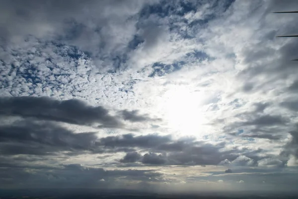 Aerial View of clouds and City houses. Beautiful High Angle Altitude View of Clouds and British Town of England UK, Air plane view at 360 degree.