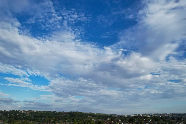 Aerial View of clouds and City houses. Beautiful High Angle Altitude View of Clouds and British Town of England UK, Air plane view at 360 degree.