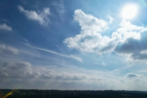 Aerial View of clouds and City houses. Beautiful High Angle Altitude View of Clouds and British Town of England UK, Air plane view at 360 degree.