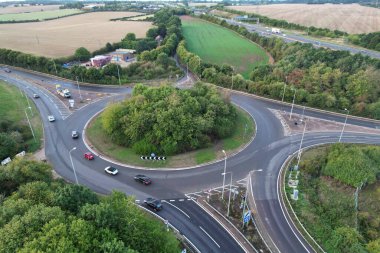 High Angle View of British Motorways at M1 and M25 Interchange. Highways are Passing from Beautiful Landscape with agricultural farms. Aerial View was captured with drone's camera on 7th Sep 2022. 