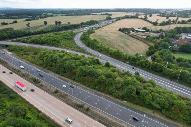 High Angle View of British Motorways at M1 and M25 Interchange. Highways are Passing from Beautiful Landscape with agricultural farms. Aerial View was captured with drone's camera on 7th Sep 2022. 