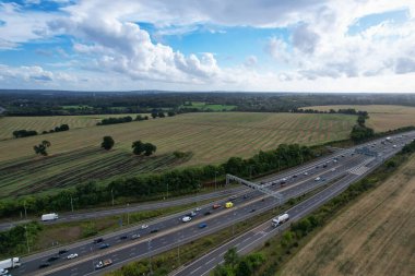 High Angle View of British Motorways at M1 and M25 Interchange. Highways are Passing from Beautiful Landscape with agricultural farms. Aerial View was captured with drone's camera on 7th Sep 2022. 