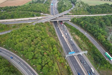 High Angle View of British Motorways at M1 and M25 Interchange. Highways are Passing from Beautiful Landscape with agricultural farms. Aerial View was captured with drone's camera on 7th Sep 2022. 