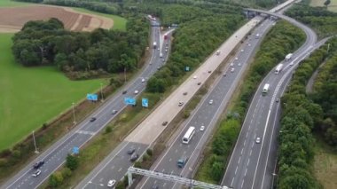 Aerial View of British Motorways With Fast Moving Traffic at Peak Time. M1 J11 and  J7 Motorways Junction Interchange. Time Lapse Shot captured on 7th Sep 2022