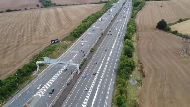 Aerial View British Motorways Fast Moving Traffic Peak Time J11 — стоковое видео