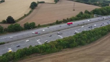 Aerial View of British Motorways With Fast Moving Traffic at Peak Time. M1 J11 and  J7 Motorways Junction Interchange. Time Lapse Shot captured on 7th Sep 2022