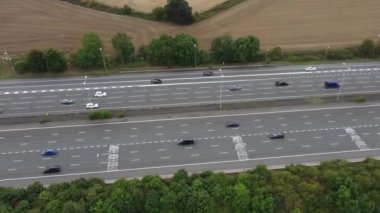 Aerial View of British Motorways With Fast Moving Traffic at Peak Time. M1 J11 and  J7 Motorways Junction Interchange. Time Lapse Shot captured on 7th Sep 2022