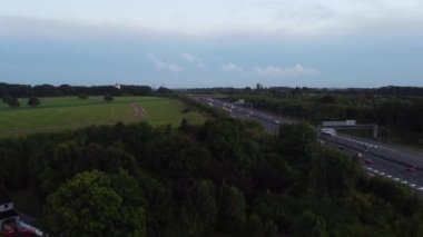 Aerial View of British Motorways With Fast Moving Traffic at Peak Time. M1 J11 and  J7 Motorways Junction Interchange. Time Lapse Shot captured on 7th Sep 2022