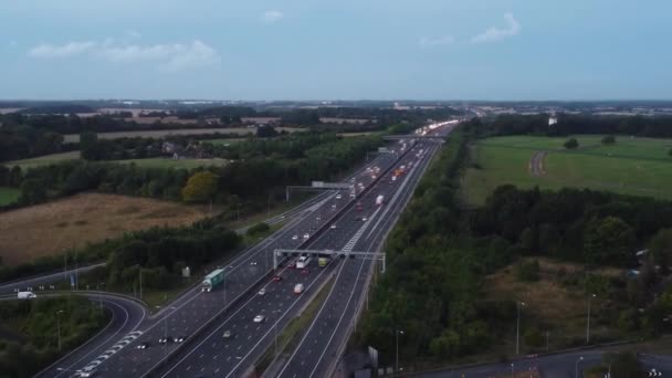 Aerial View British Motorways Fast Moving Traffic Peak Time J11 — Stock videók