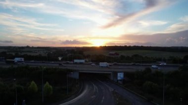 Aerial View of British Motorways With Fast Moving Traffic at Peak Time. M1 J11 and  J7 Motorways Junction Interchange. Time Lapse Shot captured on 7th Sep 2022