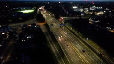 Aerial View of British Motorways With Fast Moving Traffic at Peak Time. M1 J11 and  J7 Motorways Junction Interchange. Time Lapse Shot captured on 7th Sep 2022