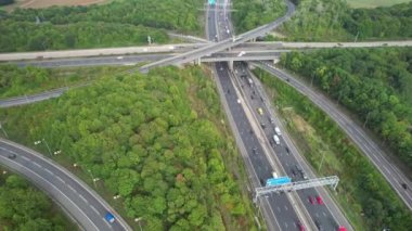 Aerial View of British Motorways With Fast Moving Traffic at Peak Time. M1 J11 and  J7 Motorways Junction Interchange. Time Lapse Shot captured on 7th Sep 2022