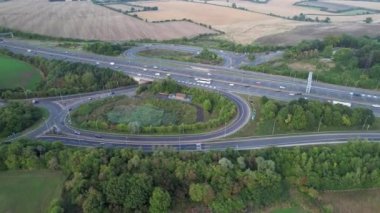 Aerial View of British Motorways With Fast Moving Traffic at Peak Time. M1 J11 and  J7 Motorways Junction Interchange. Time Lapse Shot captured on 7th Sep 2022