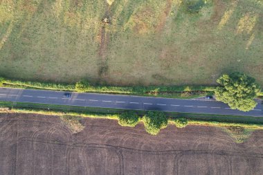 High angle footage and aerial view of harvesting crops at farm view on a sunny day at London Near to St Albans England.