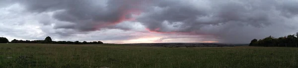 Beautiful and Dramatic Clouds at Sunset Time over British Countryside Landscape