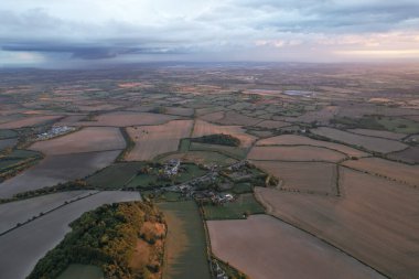 Beautiful and Dramatic Clouds at Sunset Time over British Countryside Landscape