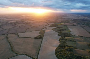 Beautiful and Dramatic Clouds at Sunset Time over British Countryside Landscape